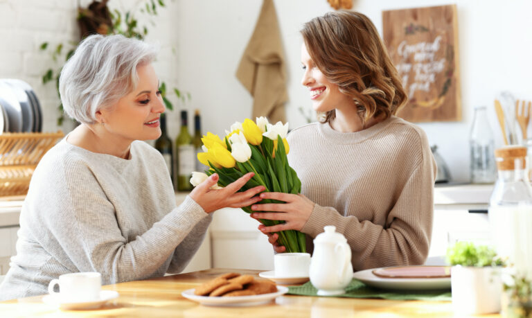 Happy,Young,Woman,Giving,Bouqet,Of,Tulips,To,Excited,Elegant